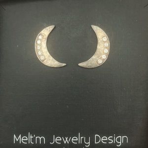 Diamond and hammered gold crescent moon earrings.